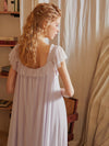 Back view of flowy pastel purple vintage sleep dress with gathered neckline