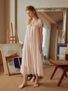 Feminine blush pink maxi sleep dress with soft draping and ruffle trim