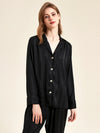 Close-up portrait of black satin stripe sleepwear set for women