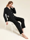 Black satin stripe pajama set with relaxed luxury sleepwear silhouette