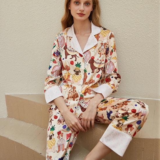 Women's satin pajama set with playful puppy and fruit print