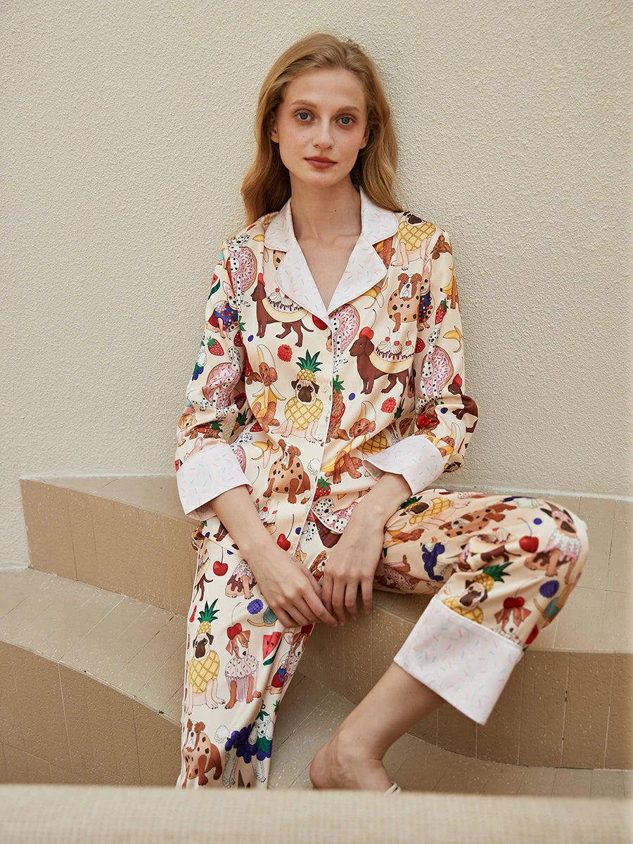 Women's satin pajama set with playful puppy and fruit print