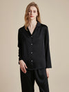 Close-up of black silky pajama top with crystal embellishment details