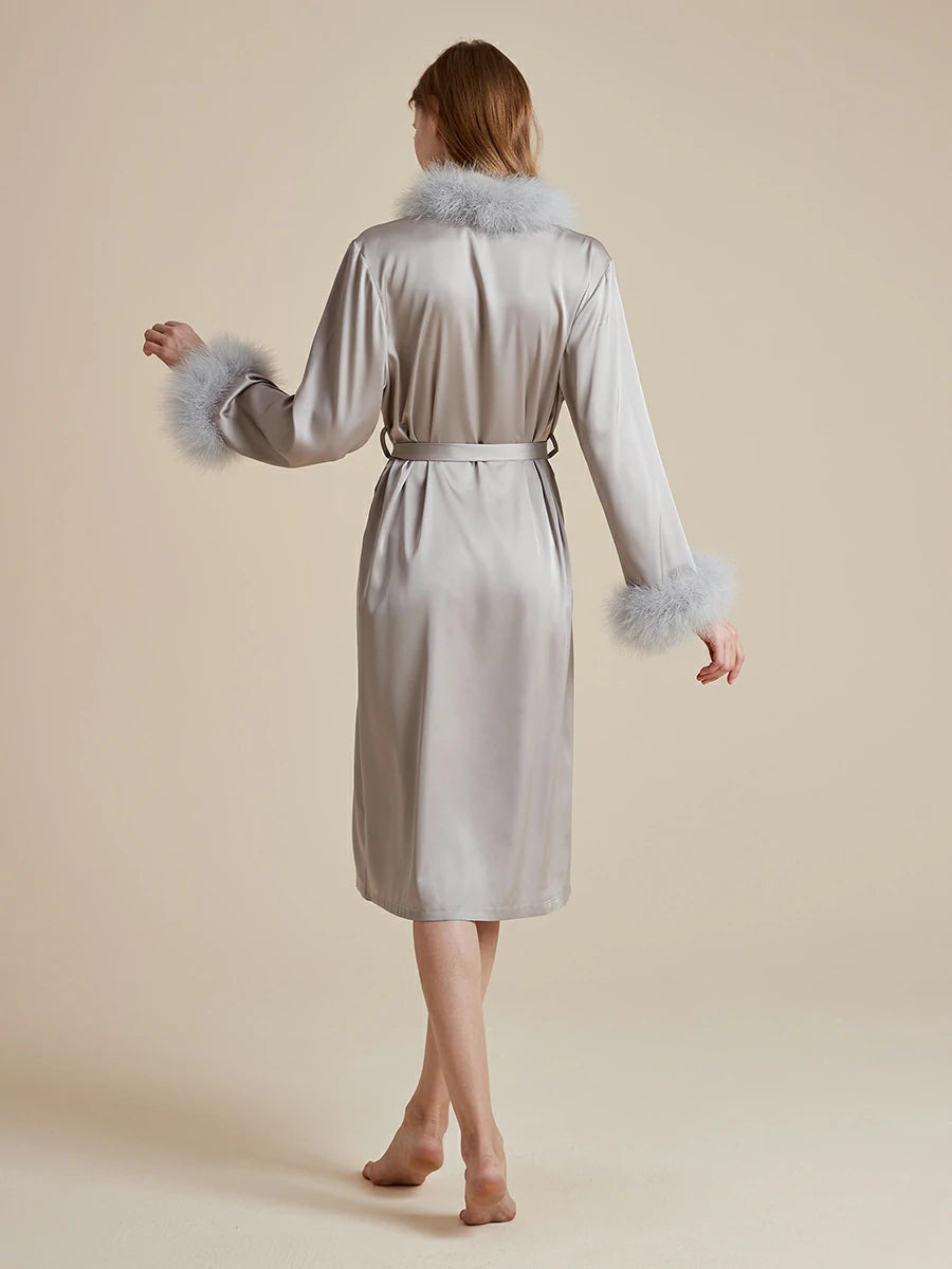 Back view of silver satin wrap robe with feather cuffs