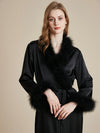 Close up of black satin feather trim luxury robe