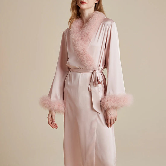 Feminine blush pink satin robe with feather accents