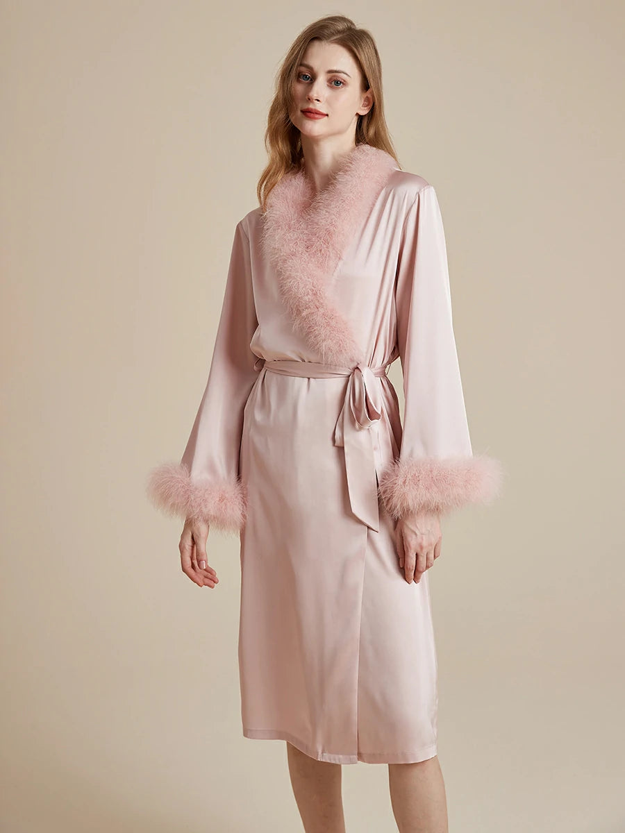 Feminine blush pink satin robe with feather accents