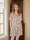 Luxury cream satin sleepwear set with chain print and matching lounge shorts