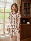 Women's silky chain print lounge set with button-up pajama shirt and shorts