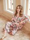 Women's pink satin pajama set with peacock feather and butterfly print