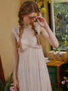 Soft pink vintage slip dress with floral lace neckline and flowing fabric