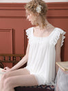 Vintage-inspired white sleepwear set with relaxed fit shorts