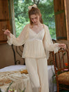 Woman wearing cream lace camisole pajama set with sheer robe