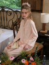 Feminine cotton sleepwear set with relaxed luxury lounge aesthetic