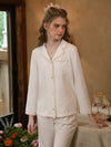 Soft white button-up pajama set with feminine vintage-inspired lace edging