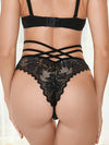 Women's black strappy lace thong panties back view