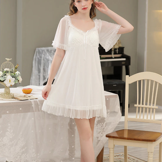 White lace nightdress with sheer flutter sleeves and ruffled hem