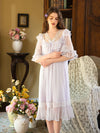 Woman lounging in airy mesh nightgown with feminine vintage styling