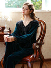 Woman wearing emerald green velvet lace pajama set
