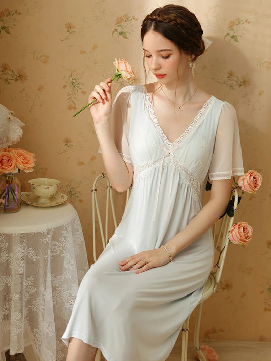 Light blue romantic lace sleep dress with ribbon bow detail and floral setting