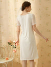 Back view of soft white flowy nightdress with sheer sleeves