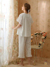 Vintage-inspired feminine loungewear with cropped pants