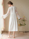 Back view of white romantic midi nightgown with soft draped silhouette