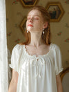Close-up of romantic puff sleeve cotton sleep dress