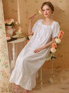 Elegant white cotton lounge dress with ruffle hem