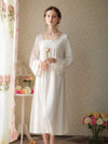 Woman wearing white vintage lace cotton nightgown
