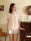 Elegant vintage-inspired women’s pajama set in blush pink
