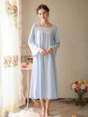 Woman wearing blue romantic long sleeve nightgown