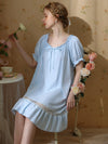 Woman wearing light blue romantic sleep dress