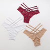 Women's lace thong panties flat lay in black burgundy white and nude