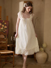 Slessic elegant ivory nightgown with sheer ruffle sleeves and flowing silhouette in warm vintage interior