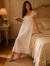 Soft flowy white lounge dress with feminine layered ruffle hem