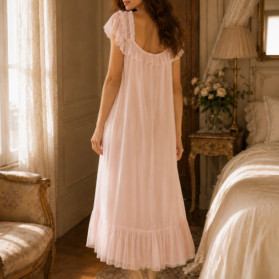 Back view of Feminine blush pink maxi sleep dress with soft draping and ruffle trim