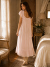 Back view of Feminine blush pink maxi sleep dress with soft draping and ruffle trim