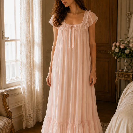 Feminine blush pink maxi sleep dress with soft draping and ruffle trim