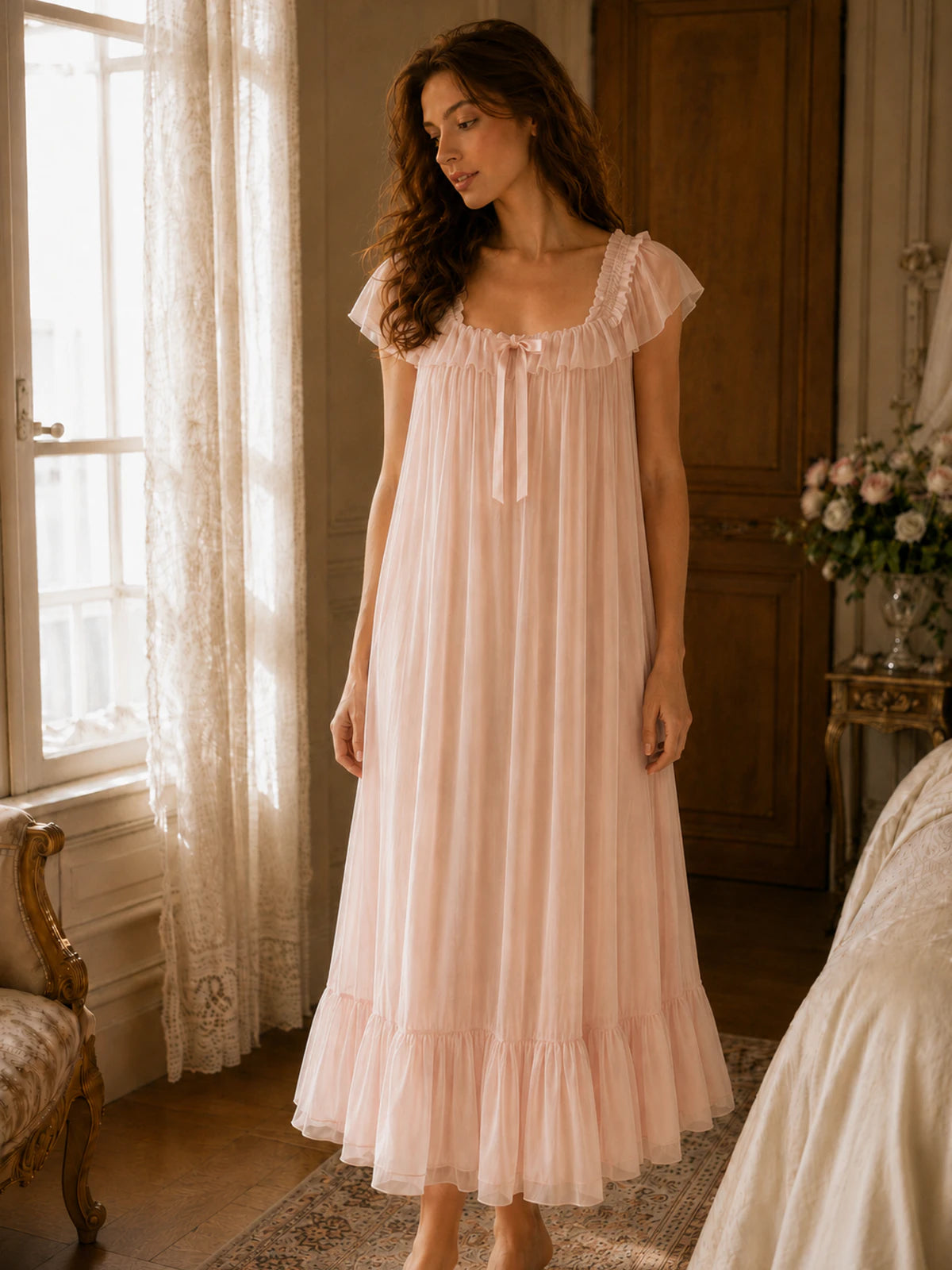 Feminine blush pink maxi sleep dress with soft draping and ruffle trim