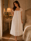 Elegant white vintage nightgown styled beside fireplace with romantic details