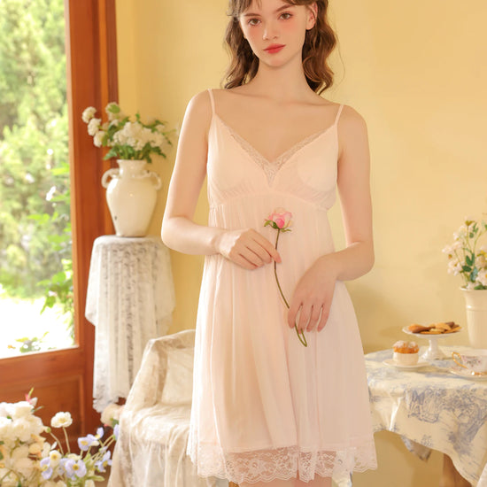 Light pink lace trim cami nightdress with sheer neckline and delicate hem