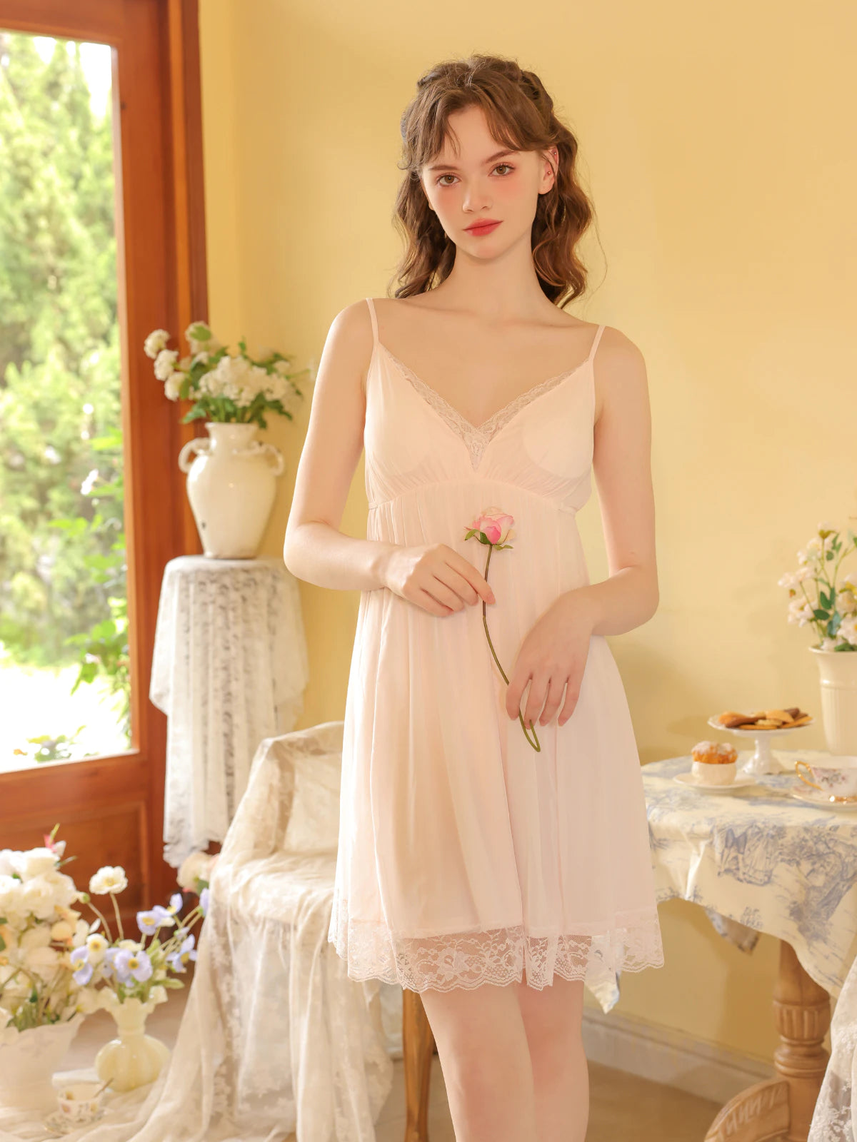 Light pink lace trim cami nightdress with sheer neckline and delicate hem