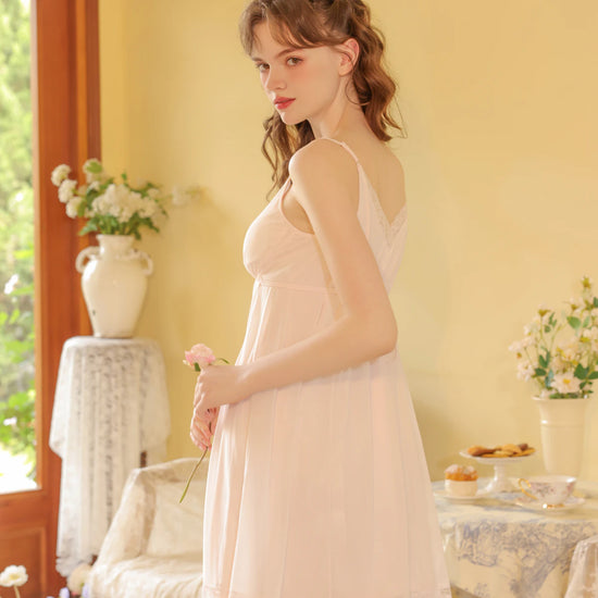 Side view light pink cami nightdress with delicate lace trim and airy skirt