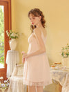Side view light pink cami nightdress with delicate lace trim and airy skirt
