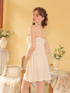 Back view white cami nightdress with slender straps and relaxed A-line shape