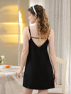 Back view black slip nightgown with slender straps and low V neckline