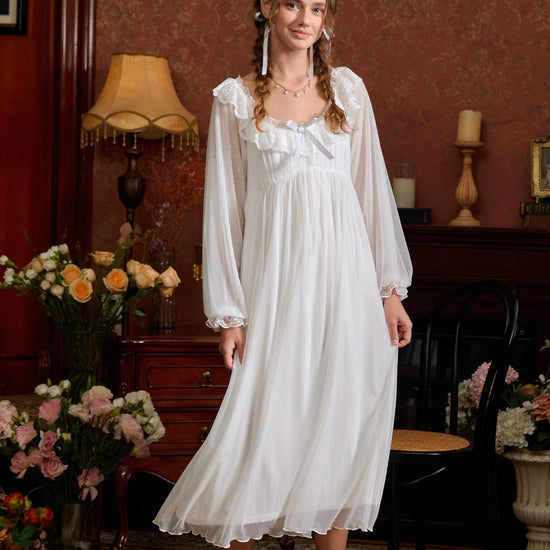 White sheer lace long sleeve nightgown shown in a full front view with a flowing tiered hem