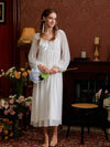 White romantic nightgown styled beside flowers, highlighting the square lace neckline and long silhouette