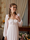 Pink sheer lace long sleeve nightgown shown from the front with a satin bow and scalloped neckline